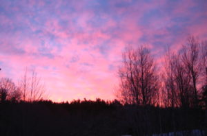 Is It Spring Yet? Living and Writing in New England by Linn Chapel - photo of pink sky at sunrise